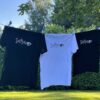 Three different T-shirts are hanging, to show the sizes and colours.